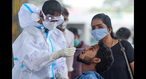 Health workers collect a sample in Bengaluru. (Photo | Ashishkrishna HP, EPS)