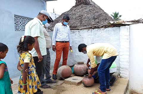 Led by block medical officer Dr S Pasupathi, health workers check mosquito breeding sources at a house in a remote village at Alangayam block in Tirupathur district