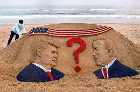 Renowned sand artist Sudarsan Pattnaik created a sand sculpture on the USA election at Puri beach, Odidha. (Photo | PTI)