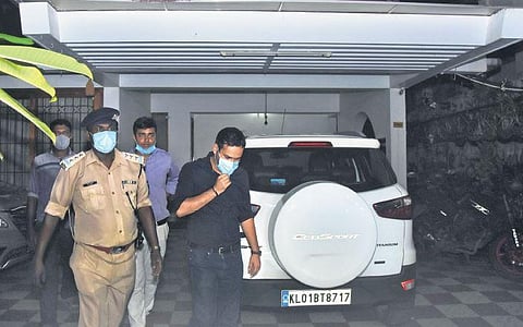 Enforcement Directorate officials come out of Bineesh Kodiyeris house at Maruthankuzhy in T’Puram on Wednesday | B P Deepu