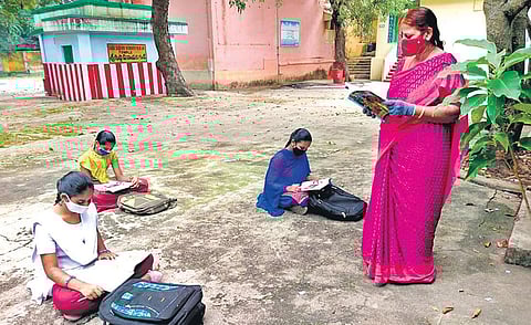 Only three students attend a class at SVBNR English Medium High School in Tirumala on Thursday due to Covid fear. (Photo | EPS)
