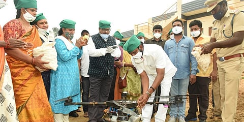 Telangana excise minister V Srinivas Goud throws seed balls through drowns in Mahabubnagar district. (Photo| EPS)
