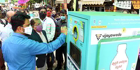 Krishna collector MD Imtiyaz and municipal commissioner Prasanna Venkatesh inaugurating plastic bottle recycling machine at IGMC stadium in Vijayawada on Thursday. (Photo | EPS)