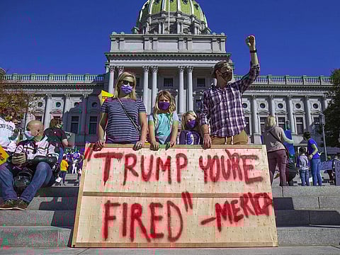 Joe Biden supporters demonstrate in front of the Pennsylvania State Capitol in Harrisburg, Pa. Saturday, Nov. 7, 2020. (Photo | AP)