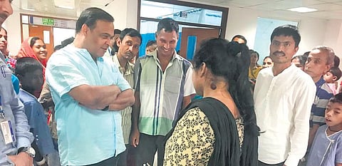 Assam health minister Himanta Biswa Sarma interacts with the mother of a child. The initiative is meant for children below 12 years of age | EXPRESS
