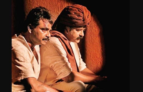 Rockline Venkatesh and Ravichandran in a still from 'Kannadiga'.