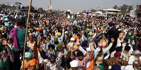 Farmers raise slogans at the Singhu border during their Delhi Chalo protest against the new farm laws in New Delhi on Thursday. (Photo | Parveen Negi, EPS)