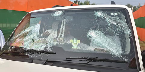 A vehicle of BJP chief JP Nadda's convoy damaged after stone-pelting by alleged TMC activists at Sirakal near Diamond Harbour, in South 24 Pargana, Bengal. (Photo | PTI)