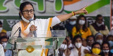 West Bengal Chief Minister Mamata Banerjee addresses at 'Dharna Manch' during a protest against the Center's farm laws in Kolkata Thursday. (Photo | PTI)