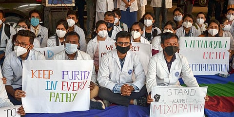 Members of Junior doctors' Association stage a protest against Mixopathy at Guwahati Medical College and Hospital (GMCH) in Guwahati. (Photo | PTI)
