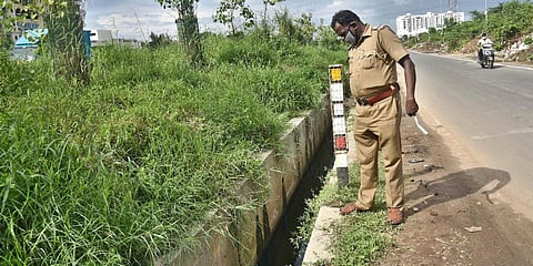 An open storm water drain posing a life threat to commuters on Chennai bypass road at Maduravoyal. (Photo| P Jawahar, EPS)