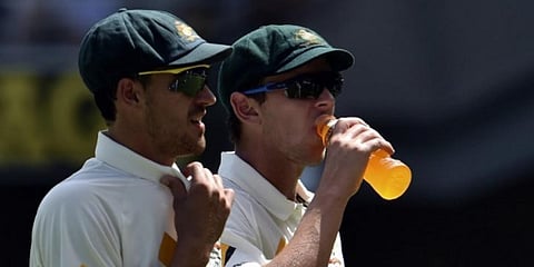 Australia's pacemen Mitchell Starc (L) and Josh Hazlewood (File photo| AFP)