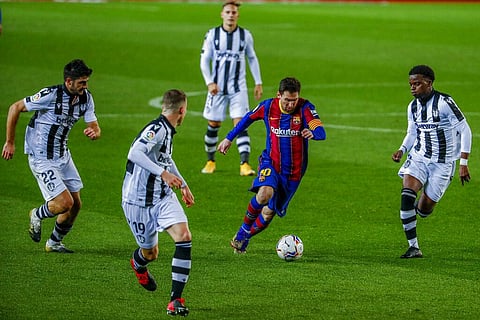 Barcelona's Lionel Messi, second right, vies for the ball surrounded with Levante players during the Spanish La Liga soccer match. (Photo | AP)