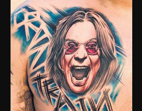 Devil’s Tattooz does not allow customers without a mask and has made shoe covers mandatory before entry. (Photo | Devil’s Tattooz)