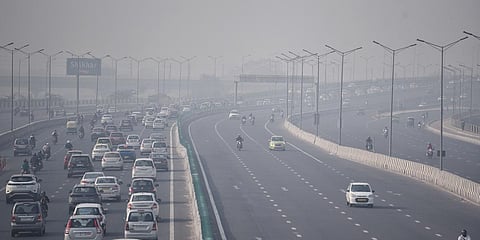 Vehicles seen moving through thick smog as the air quality deteriorates with the rise of pollutants in the atmosphere, in New Delhi. 