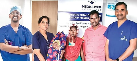 Baby delivered during a rare open heart surgery