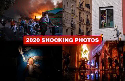 This is the world that photographers captured in 2020, a world beset by every sort of catastrophe -- natural and unnatural disaster, violent and non-violent conflict. (Photo | AP)