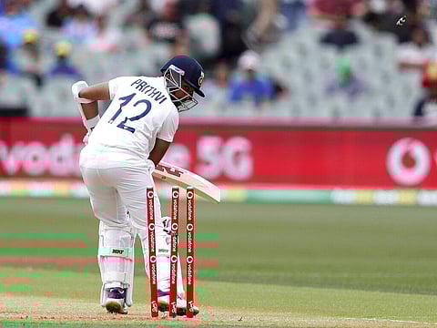 India's Prithvi Shaw turns to see he's bowled on the second delivery from Australia during their cricket test match at the Adelaide Oval in Adelaide. (Photo | AP)