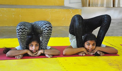 Students participate in asana competition in Visakhapatnam. (Photo | G Satya