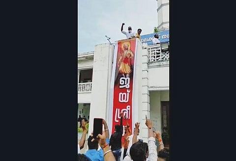 One of the banners displayed at the Palakkad Municipality office after the BJP won the polls on Wednesday. (Photo | EPS)