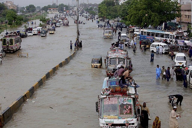 In this August 27, 2020, vehicles drive through a flooded road after heavy monsoon rains, in Karachi, Pakistan. Heavy monsoon rains lashed many parts of Pakistan as well the southern port city of Karachi, leaving flooding streets, damaging homes and displacing scores of people. This year has seen record Atlantic hurricanes and western wildfires, devastating floods in Asia and Africa and a hot, melting Arctic. It's not just been a disastrous year, but a year of disasters. (Photo | AP)