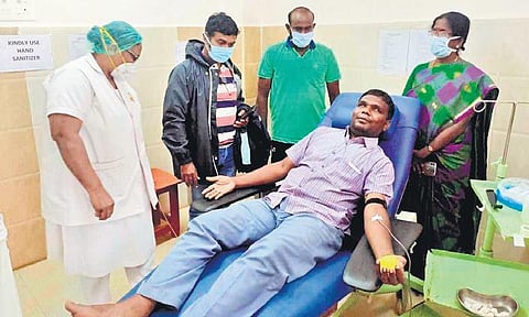 Visually impaired Siva at the Pudukottai Medical College donating blood on Thursday after a hearing impaired woman needed blood. (Photo | EPS)