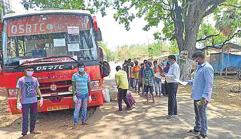 Migrant workers boarding a bus at Motu to reach Kalahandi district  in this file photo.  (EPS)