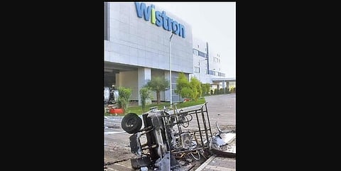 A vehicle was burnt in the Wistron plant violence in Kolar recently. (Photo | EPS)