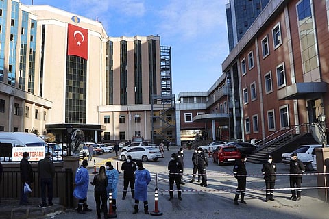 Police and medics gather outside the privately-run Sanko University Hospital in Gaziantep, southeastern Turkey