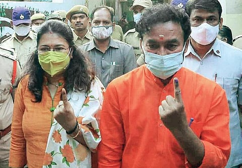 Union Minister of State for Home Affairs G Kishan Reddy and his wife after casting their vote in the GHMC polls on Tuesday