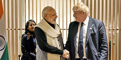 PM Narendra Modi with his English counterpart Boris Johnson. (File Photo| PTI)