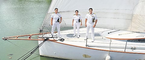 Capt Atool Sinha with Lt Commander Tulika Kotnala and Lt Surabhi Bhawsar pose on board sailing boat Bulbul at the Southern Naval Command, Kochi | Albin Mathew