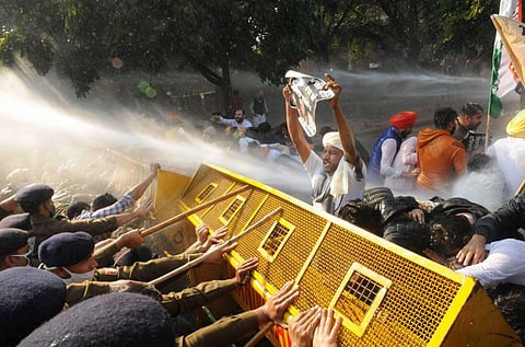 Police use water cannons and barricades to stop Youth Congress workers who were marching towards Haryana CM Manohar Lal's residence in protest over new farm laws. (Photo | PTI)