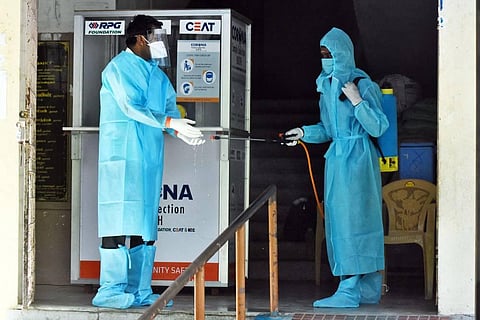 Disinfectants been sprayed at the COVID care center at Kamarajar avenue in Adyar, Chennai. (Photo | Ashwin Prasath, EPS)