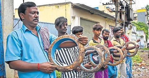 Percussionists in Tiruchy with their damaged Thappu instruments. (Photo| MK Ashok Kumar, EPS)