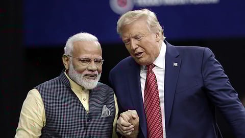 Donald Trump shakes hands with PM Narendra Modi