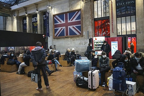 Passengers wearing face mask wait next to the Eurostar Terminal at Gare du Nord train station in Paris, Monday Dec. 21, 2020. (Photo | AP)