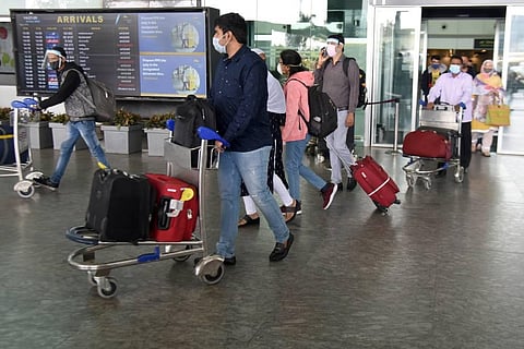International passengers arriving to Kempegowda International Airport on Wednesday with all safety measures in place. (Photo | Nagaraja Gadekal/EPS)