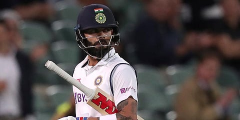 India's Virat Kohli walks off after he was run-out by Australia for 74 runs during their cricket Test match at the Adelaide Oval. (Photo | AP)
