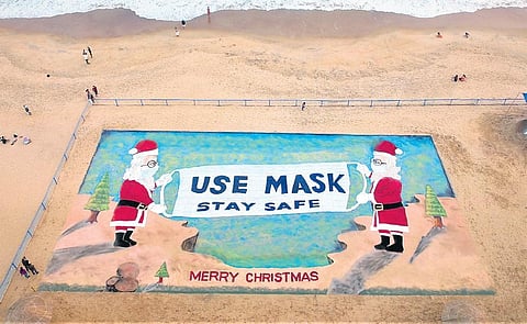 A 120ft-long, 50ft-wide 3D sand art of Santa Claus created by Sudarsan Patnaik at Puri beach on Thursday | Express