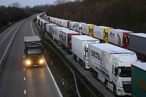 Trucks are parked up on the M20, as more arrive to join the queue, part of Operation Stack in Ashford, Kent, England, Friday. (Photo | AP)