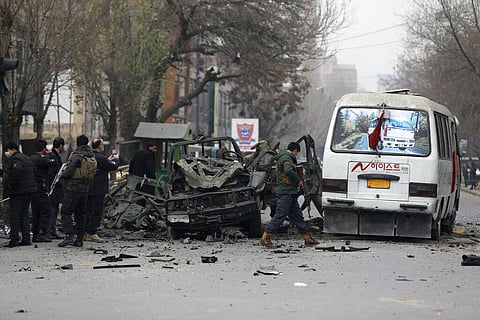 Afghan security personnel inspect the site of a bomb attack in Kabul, Afghanistan. (Photo | AP)
