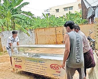 Siragukal team members taking out a freezer box | SPECIAL ARRANGEMENT