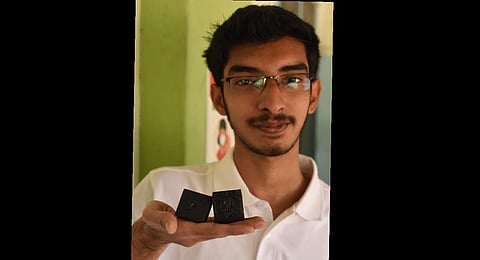 S Riyasdeen, SASTRA student with the two lightest satellites designed by him and to be launched by NASA.  (Special arrangement)