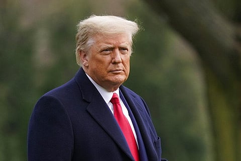 President Donald Trump walks on the South Lawn of the White House in Washington before boarding Marine One. (Photo | AP)