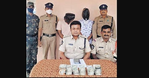 Mydukur DSP B Vijay Kumar produces two of three ATM custodians accused of  siphoning off `60 lakh, before mediapersons in Kadapa on Sunday | Express