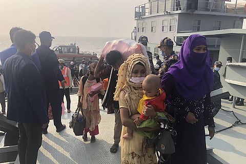 Rohingya refugees disembark from a Bangladesh Navy ship to the island of Bashar Char in Noakhali on December 4, 2020. (Photo | AFP)