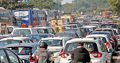 Vehicles stuck in traffic jam at the DND flyway due to the farmers protest at Delhi-Noida border on Wednesday. (Photo | EPS/Shekhar Yadav)