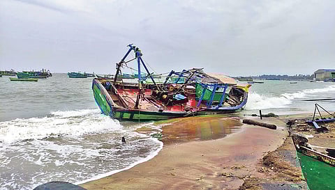 Fishing boats tossed by heavy wind at Pamban in Rameswaram on Wednesday