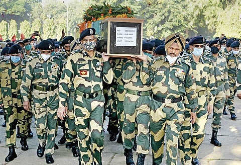 BSF personnel carry the mortal remains of sub inspector Paotinsat Guite | Pti